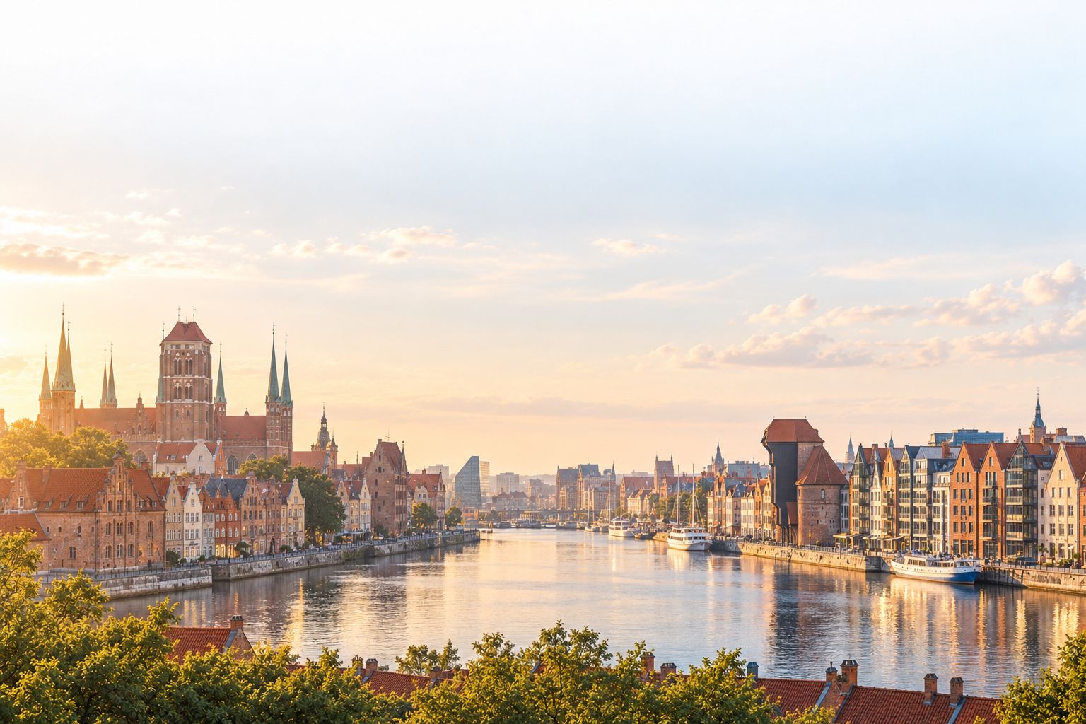 The Motława in Gdańsk at golden hour: brick churches and gabled houses on one bank, the medieval crane and Granary Island's new apartment blocks on the other