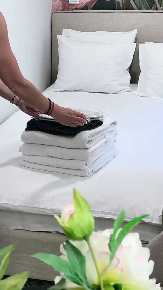 Fresh towels being prepared in a Resipilot apartment